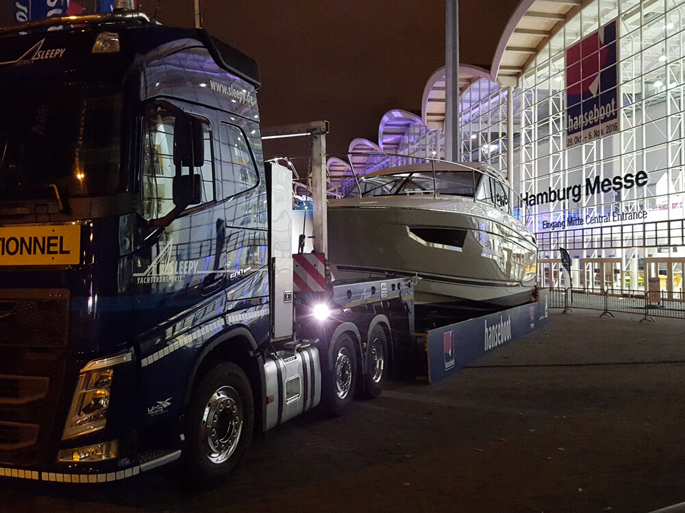 Sleepy Vehicle with loaded Yacht transport to hanseboot | Sleepy Yacht & Special Transport